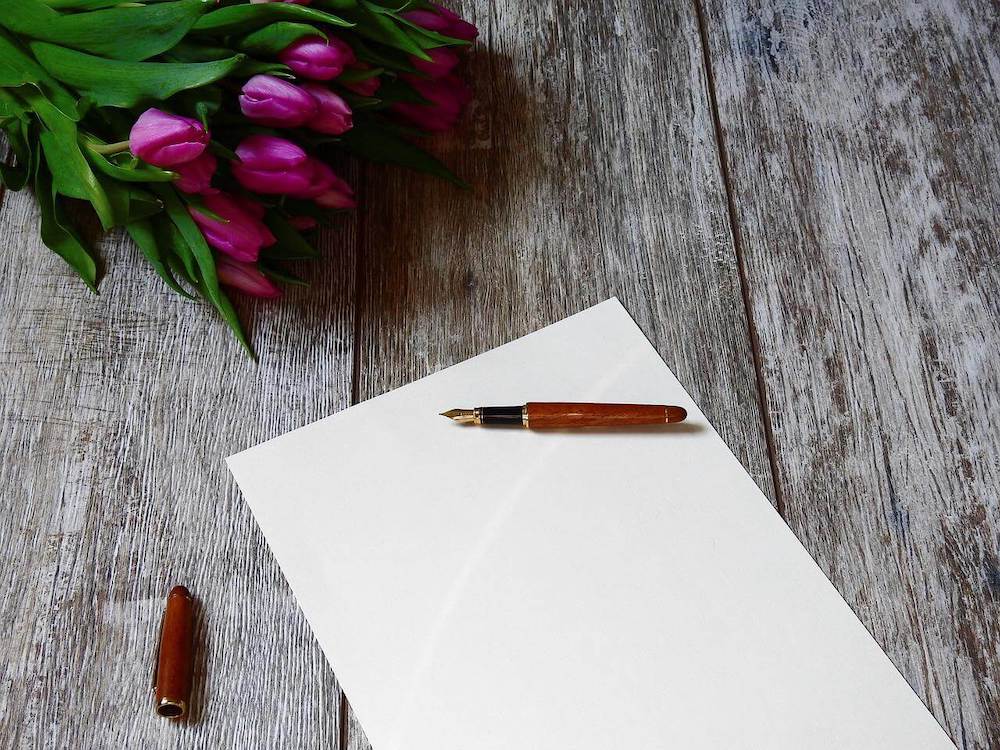 https://cdn.onmycanvas.com/wp-content/uploads/2019/05/a-paper-with-pen-as-feature-image-for-writing-tips-for-beginner-writers-1.jpeg