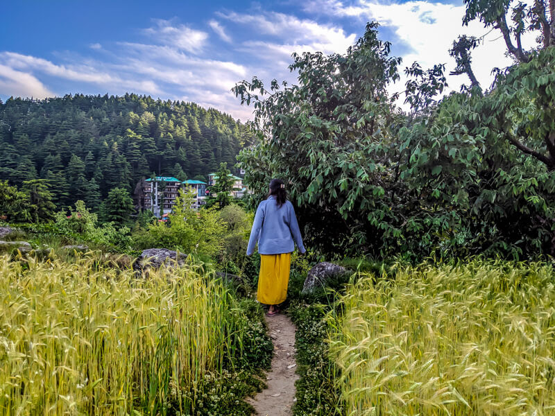 feature+image+girl+walking+in+bhagsunaag+beautiful+villages+in+himachal+pradesh