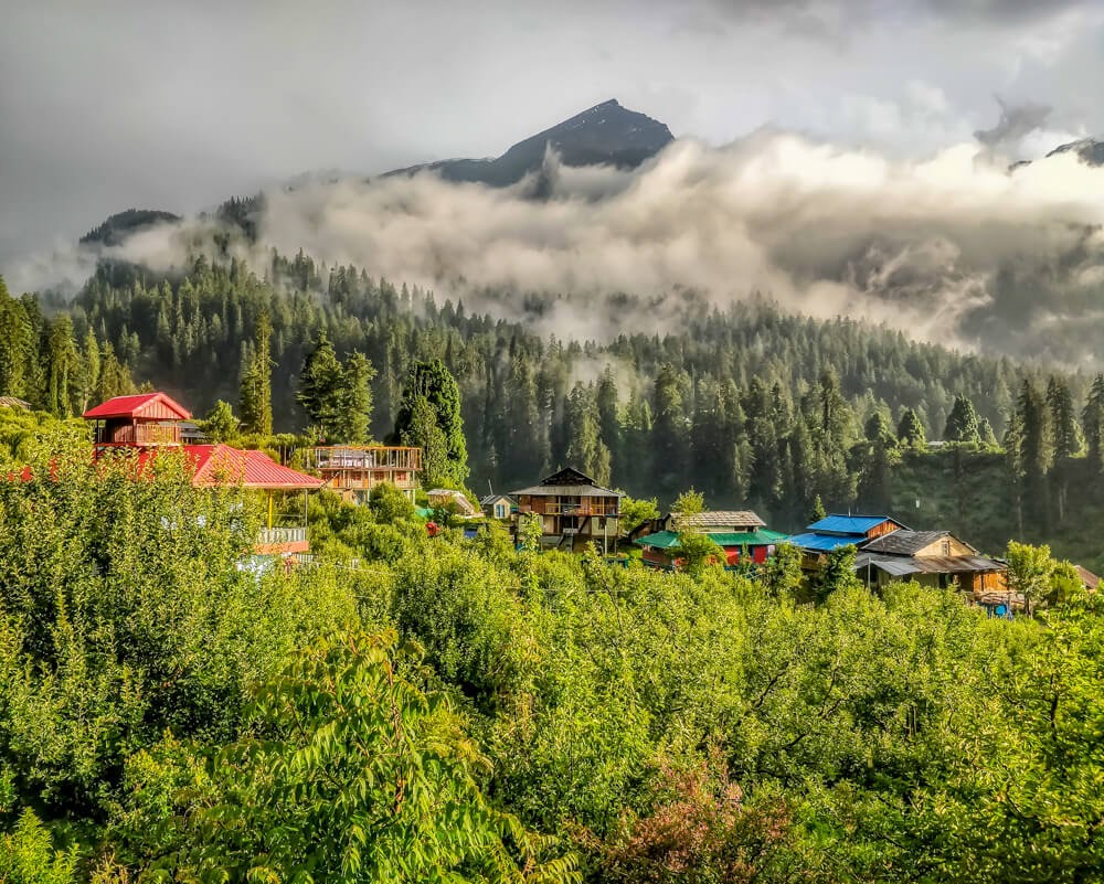 clouds+above+himalayan+mountains+kalga+village+parvati+valley+himachal