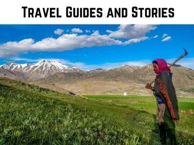 travel stories and guides category shown through a farmer Spitian woman in Himachal Pradesh India carrying an axe on her shoulder