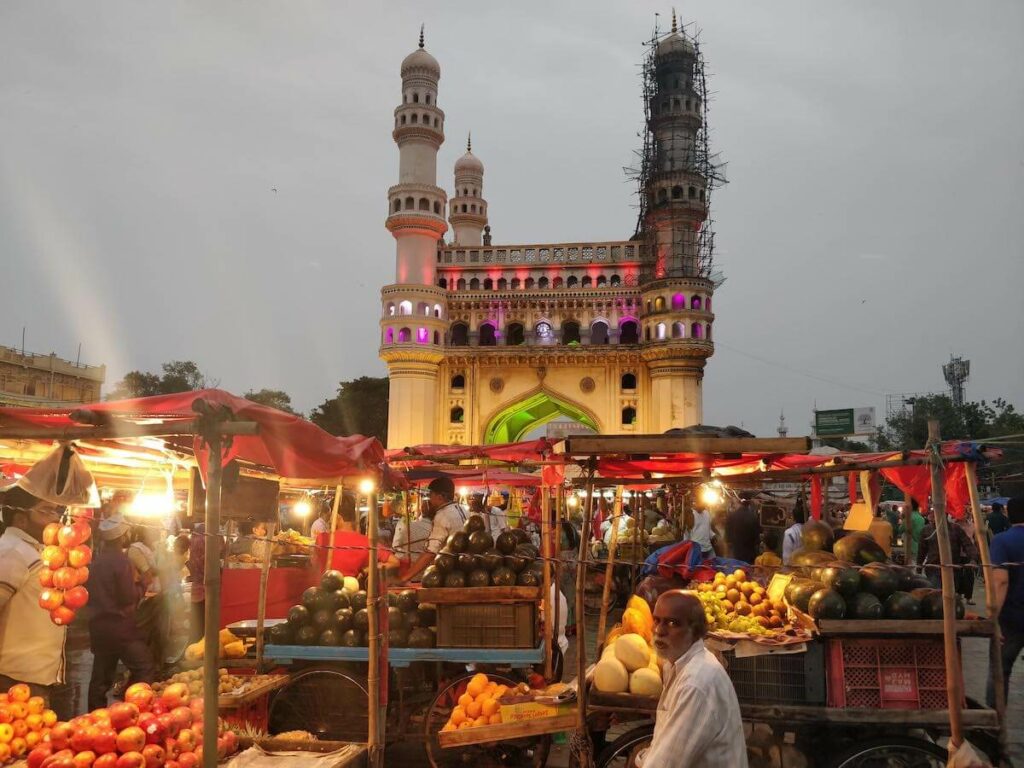 old man sitting outside charminar selling fruits hyderabad